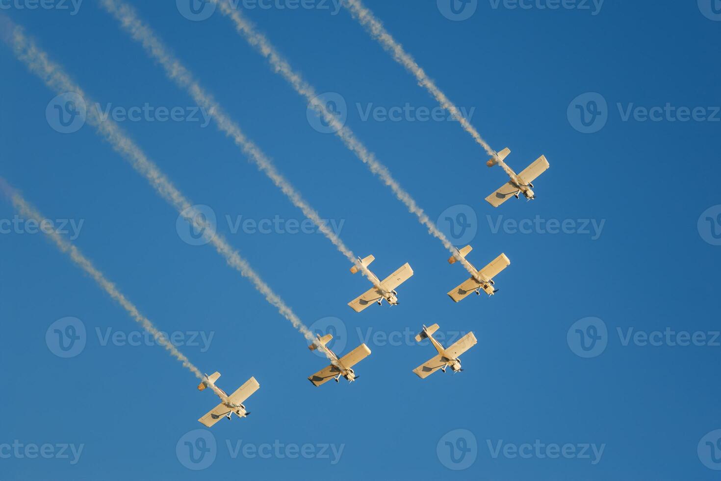 Stunt aerobatic planes performing stunts in air photo