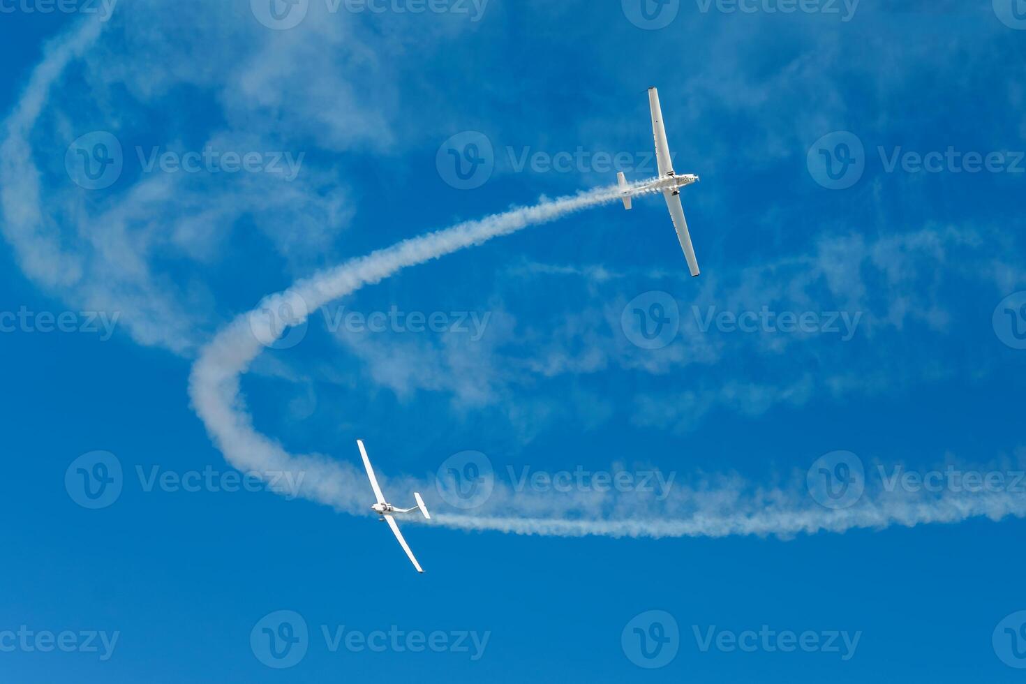 Stunt aerobatic plane performing stunts in air photo