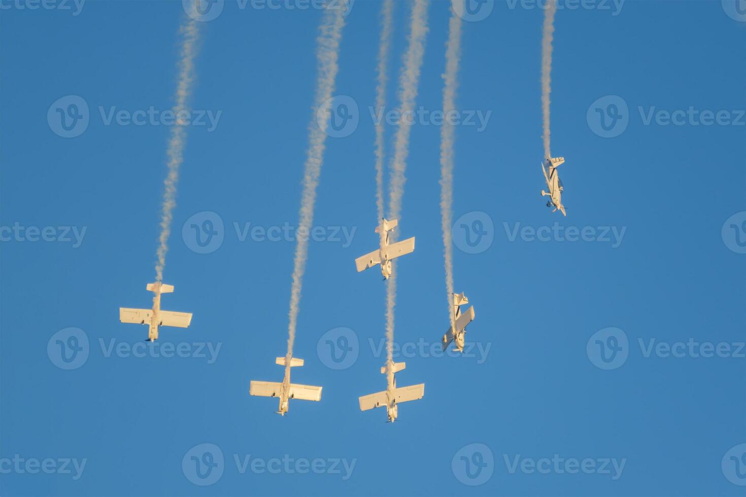 Stunt aerobatic planes performing stunts in air photo