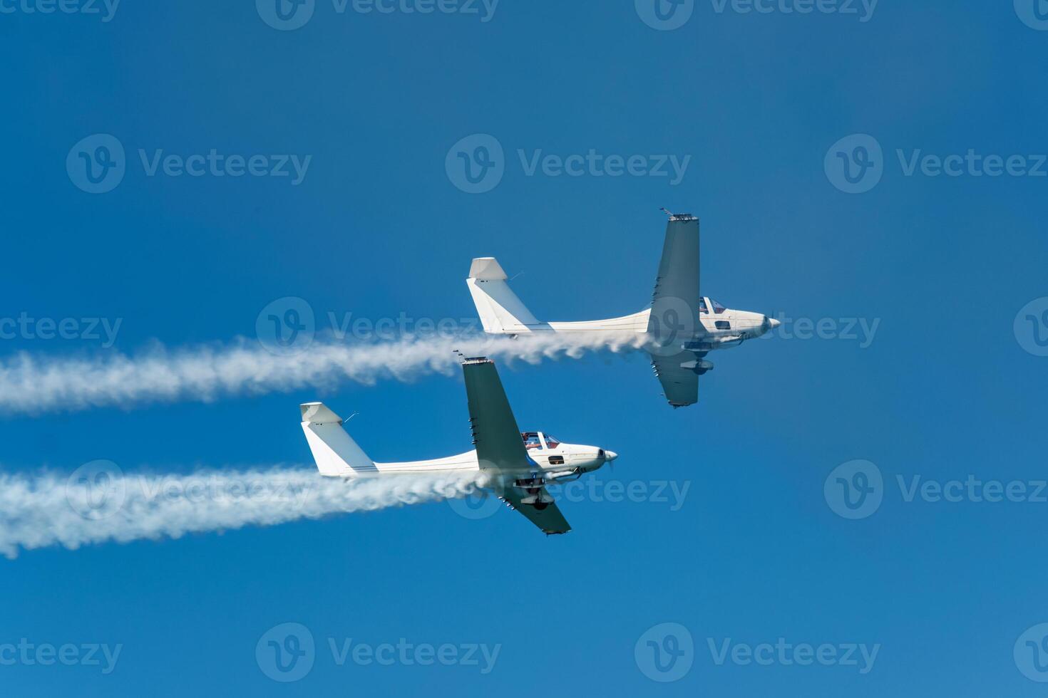 Stunt aerobatic plane performing stunts in air photo