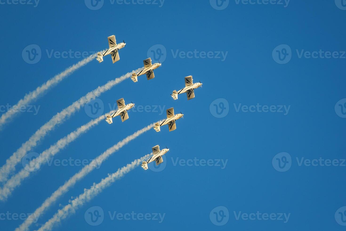 Stunt aerobatic planes performing stunts in air photo