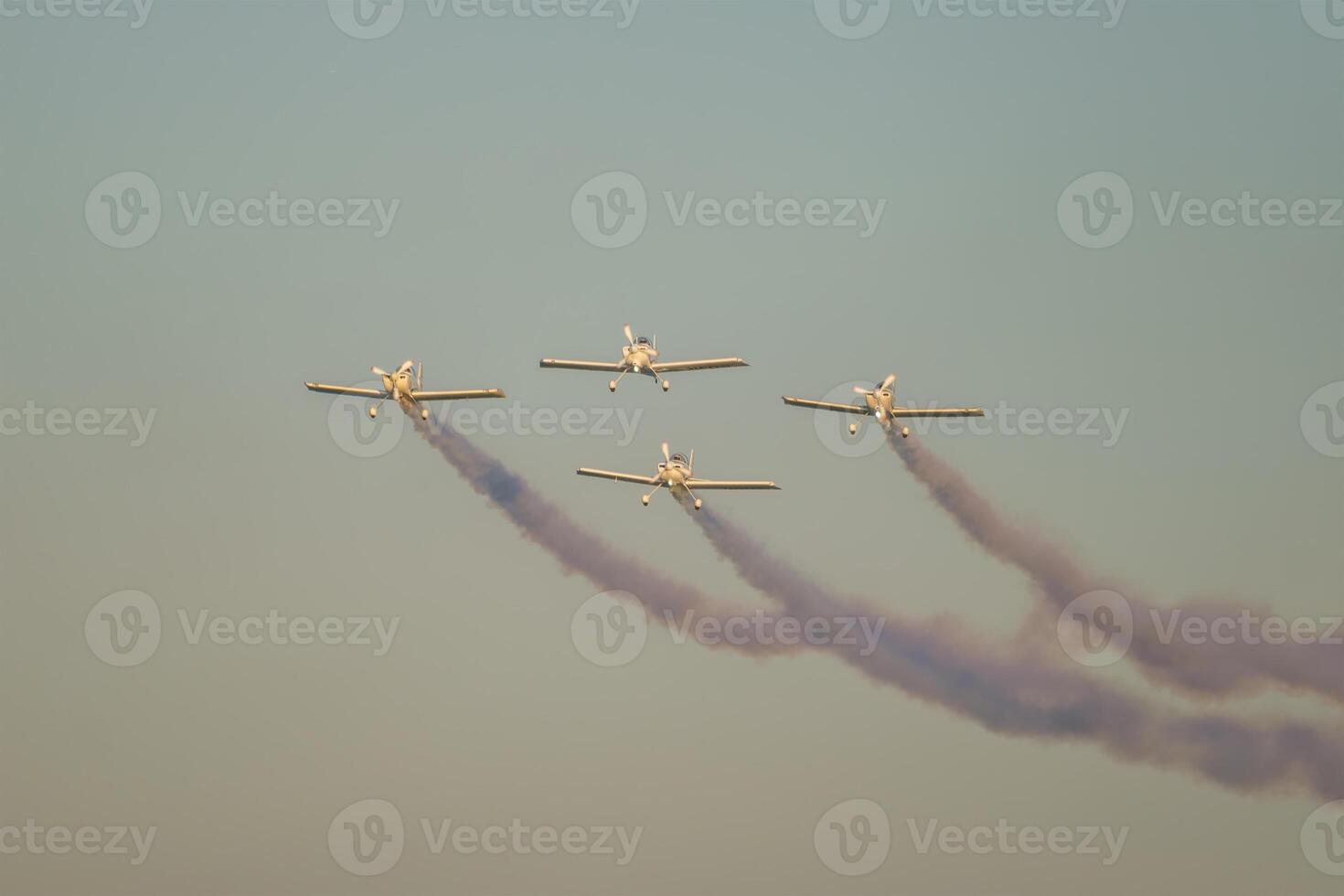 Stunt aerobatic planes performing stunts in air photo