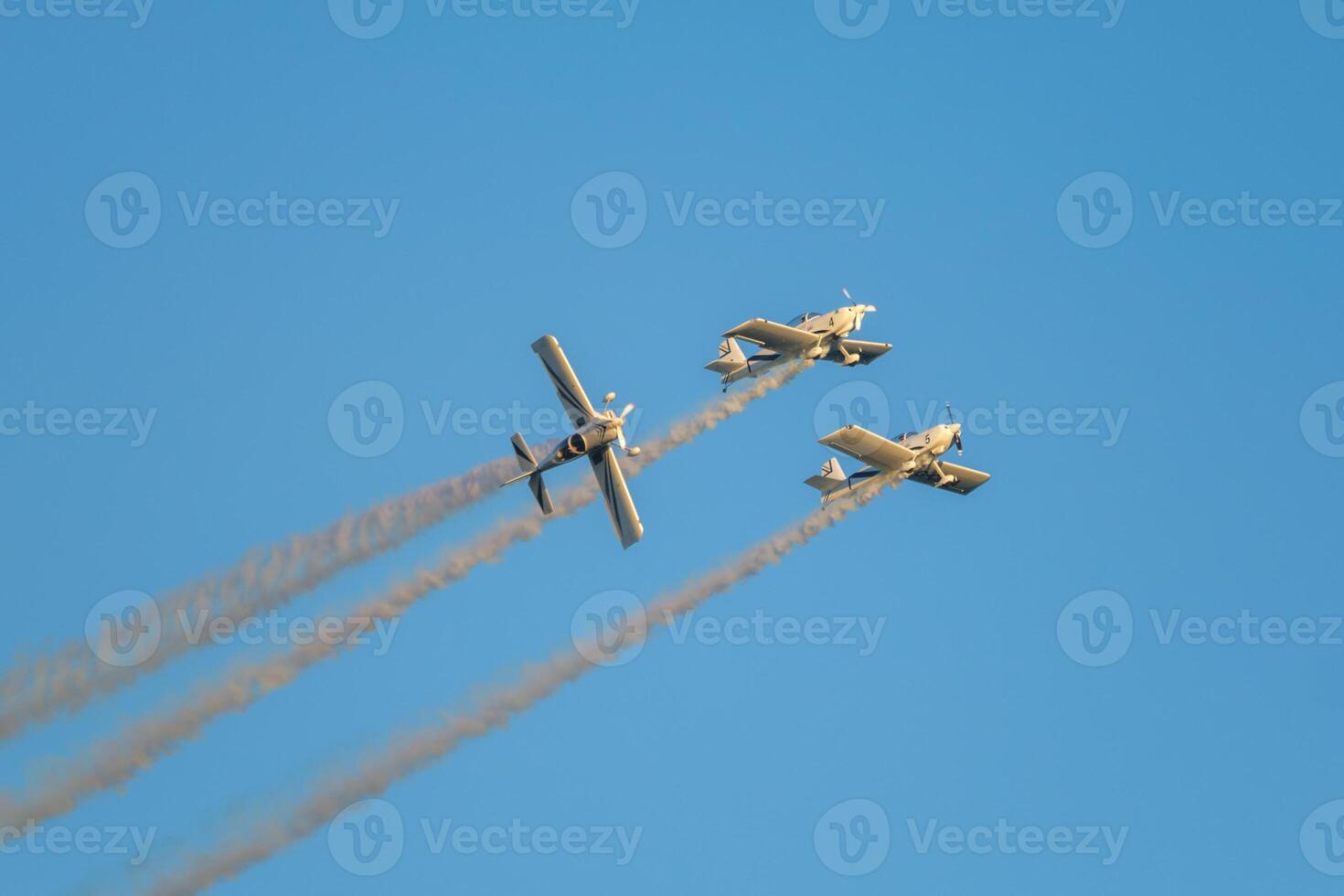 Stunt aerobatic planes performing stunts in air photo