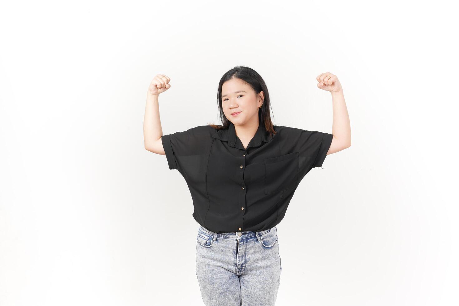 beautiful Asian woman strikes a bodybuilding pose, raising her arms confidently against a white background photo