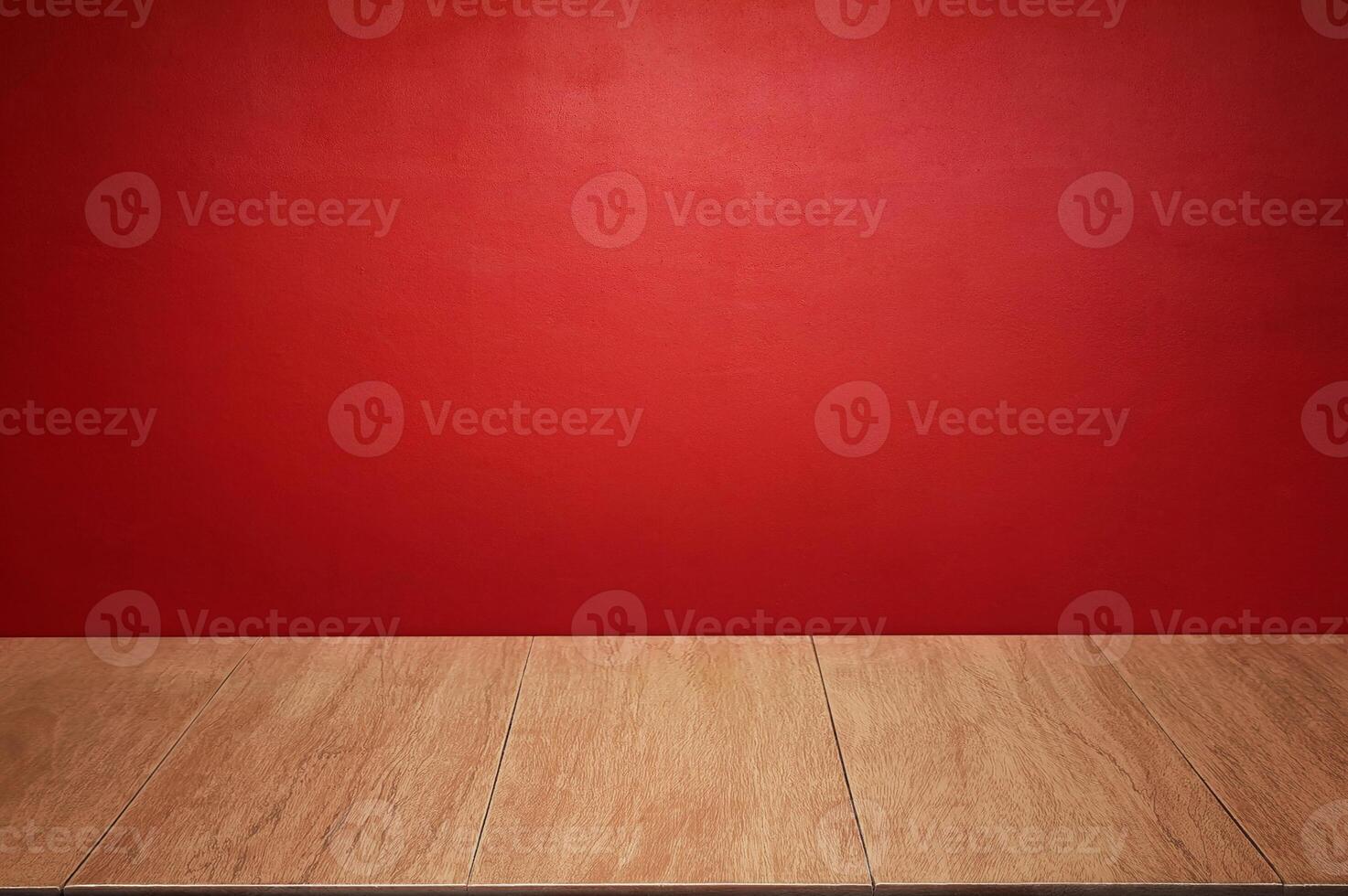 The wooden floor and walls of the room are colored red as the background. photo