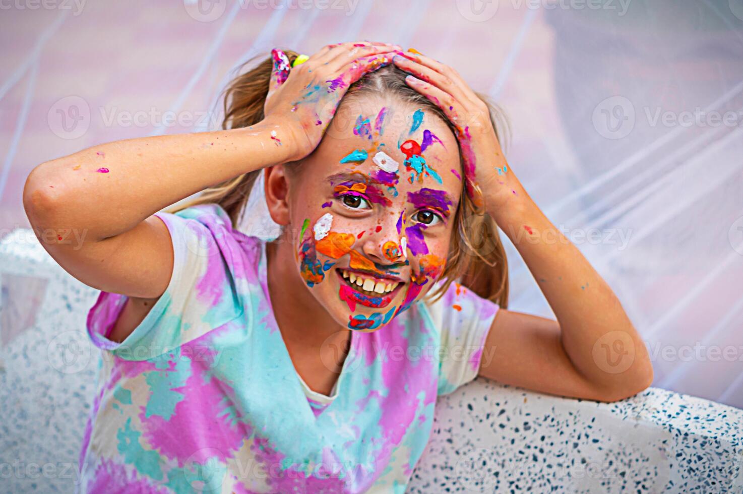 girl smeared with paint photo