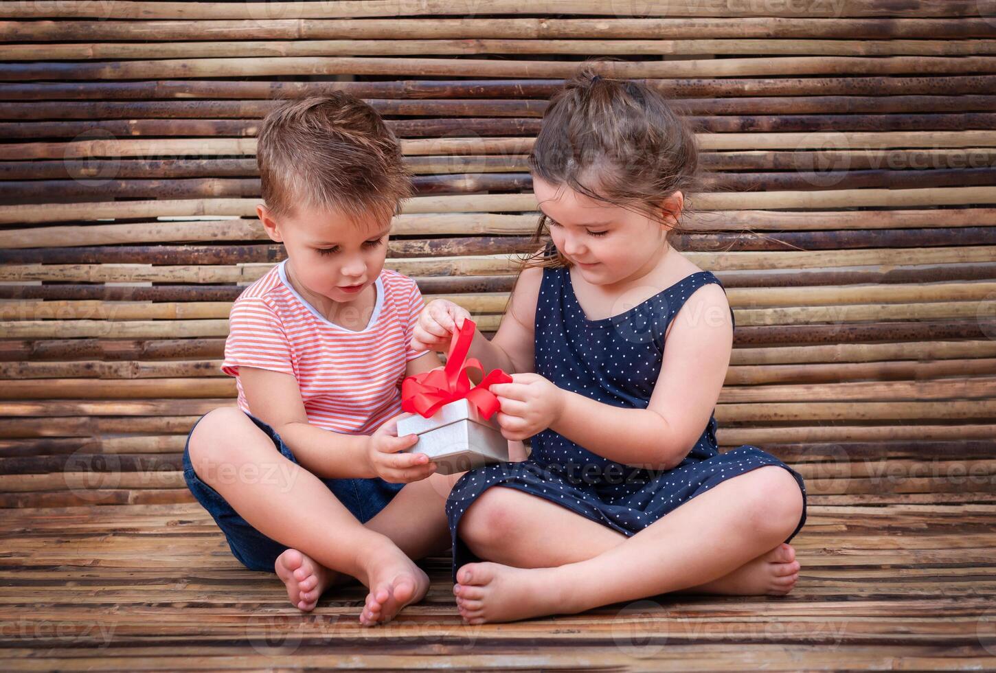 children open a gift box photo
