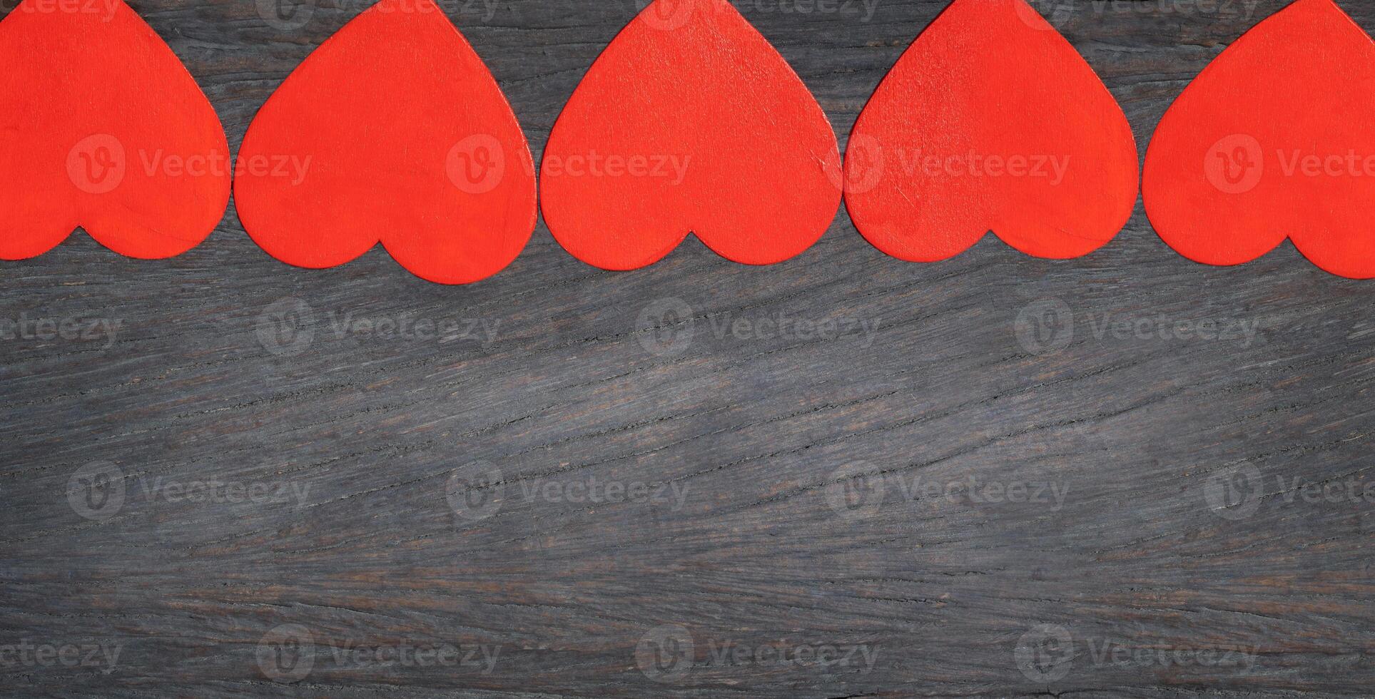 five red hearts on background photo
