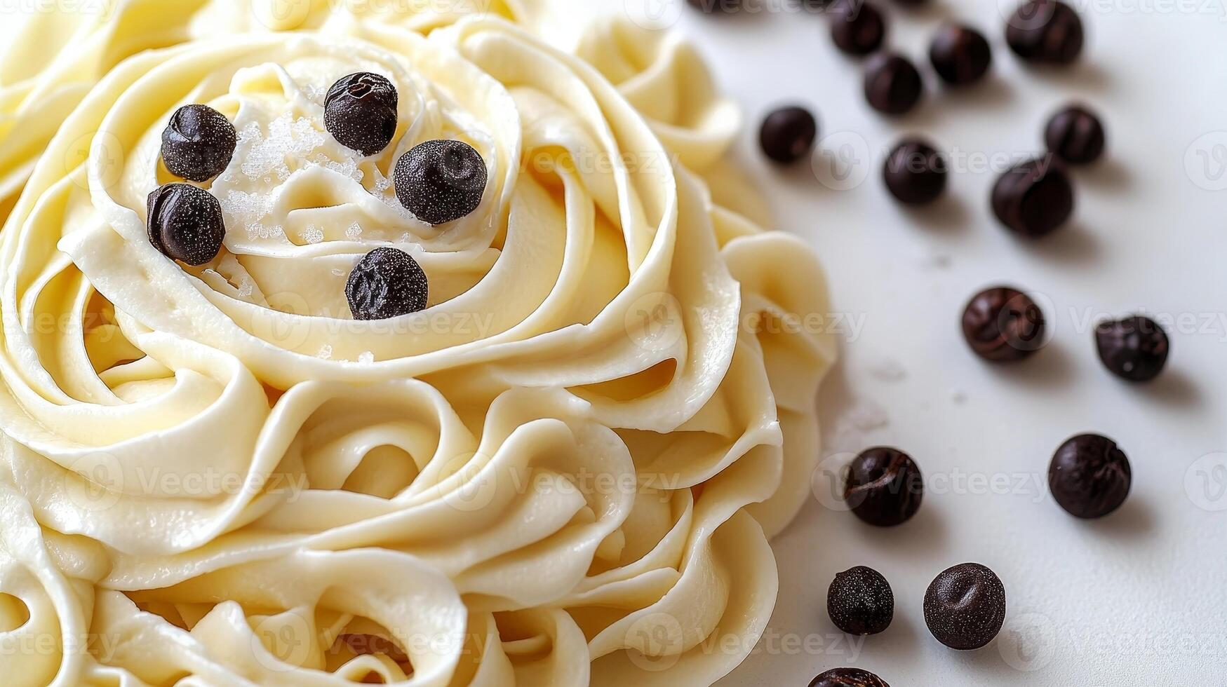 Delicate swirl of creamy pasta topped with rich chocolate drops on a pristine surface in a cozy kitchen setting photo