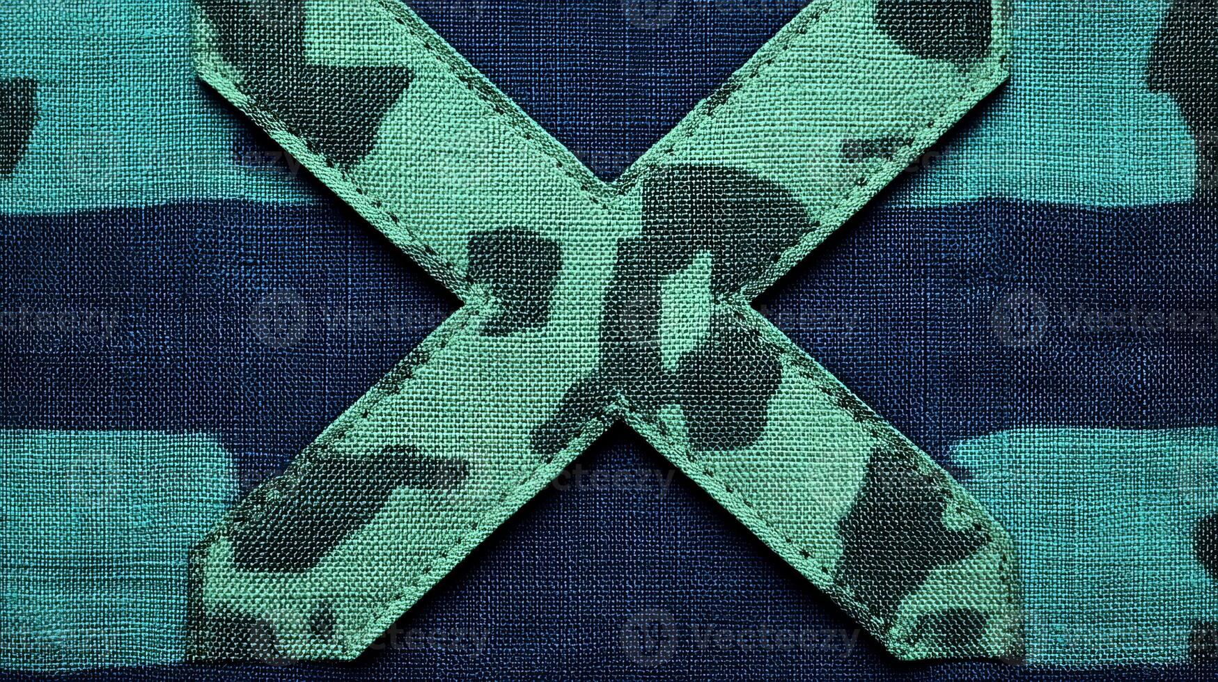A detailed view of a camo patch stands out against a textured blue fabric, highlighting artistry photo