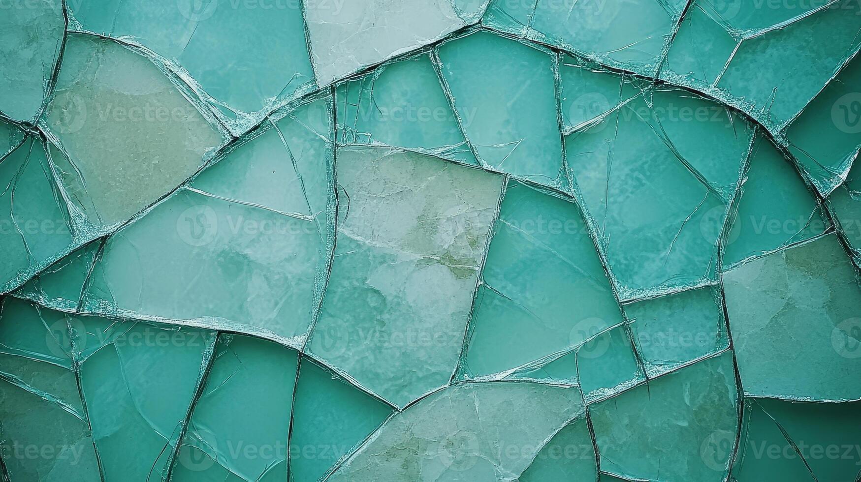 Fragments of turquoise glass blend together, creating an abstract and colorful display of texture photo