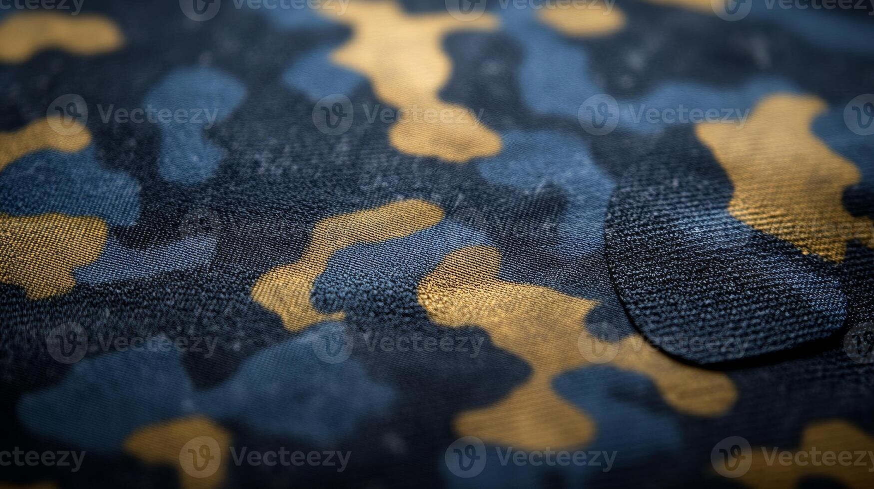 The intricate design of blue and gold camouflage fabric captures attention with its tactile details photo