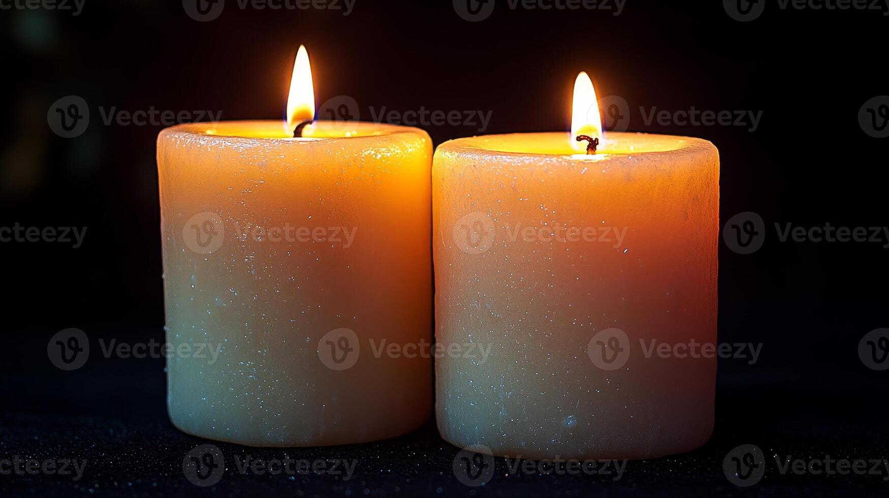 Two flickering candles illuminate a serene space, creating an inviting atmosphere of calm photo