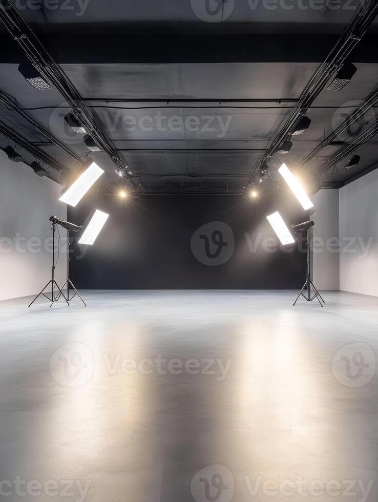 This is a spacious and completely empty photo studio that boasts modern lighting setups along with a sleek, minimalistic design, making it the ideal space for an array of diverse photography projects