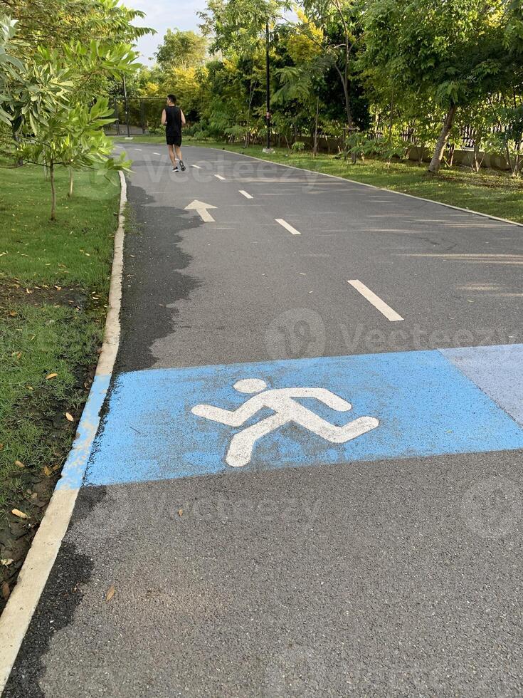 running man symbolic on route park background photo