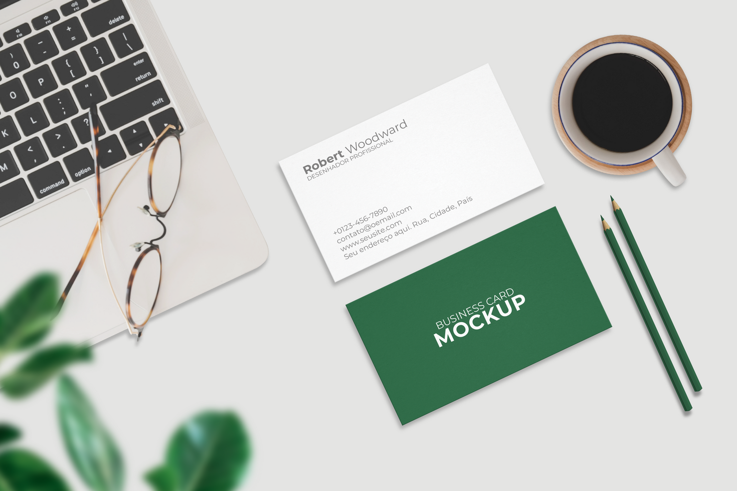 Business card mockup design with laptop and coffee psd