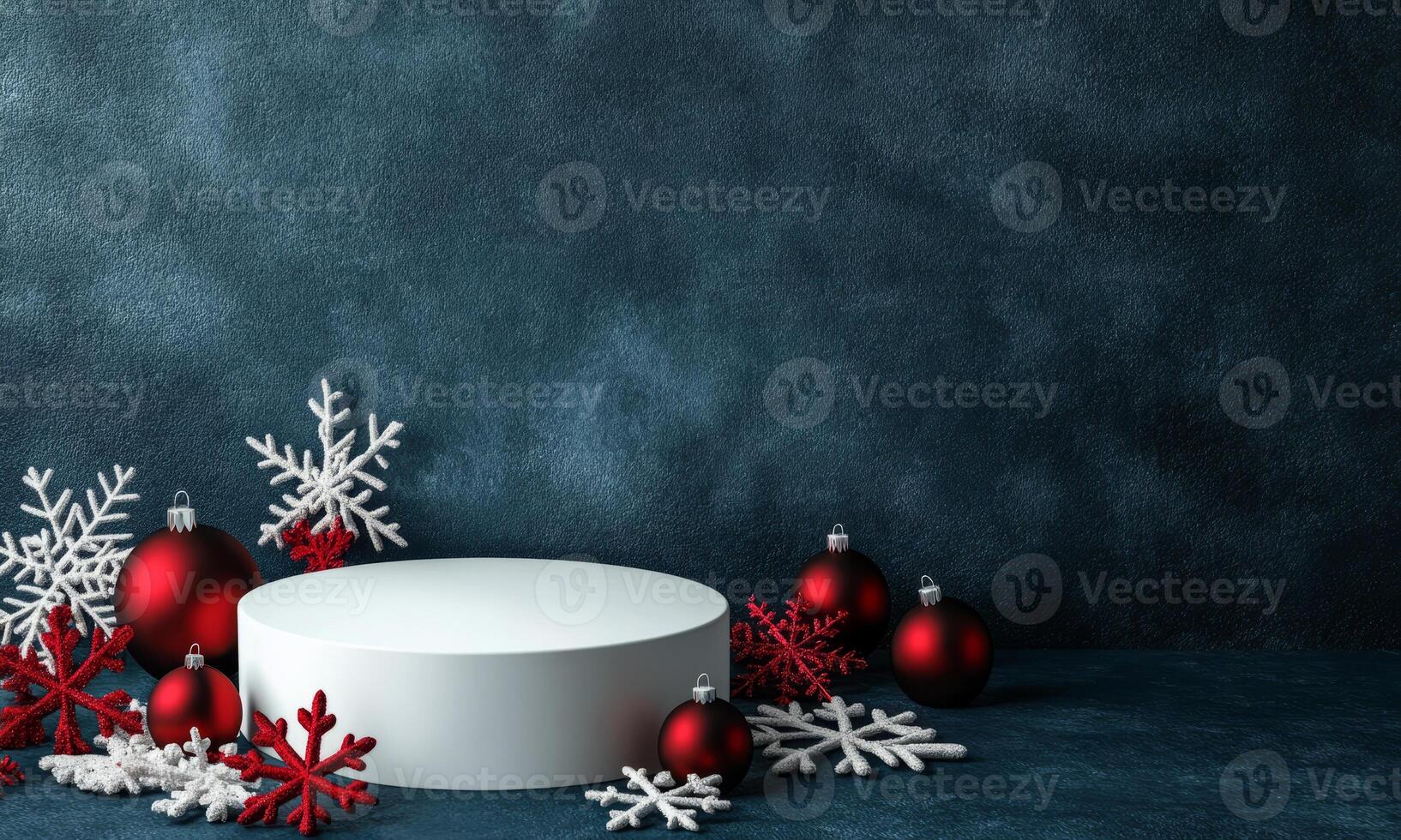 White round podium with red Christmas baubles on dark blue background, snowflakes and glitter around. Festive minimalistic winter background. photo