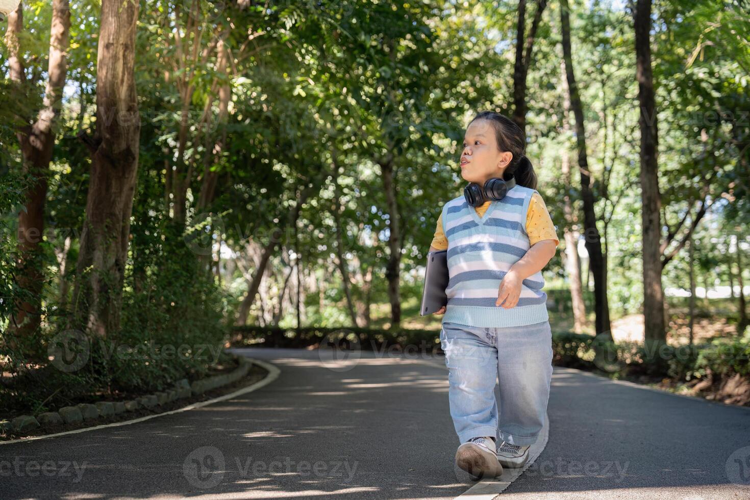 Confident Individual with Achondroplasia Enjoying a Walk in a Serene Park Setting on a Sunny Day photo