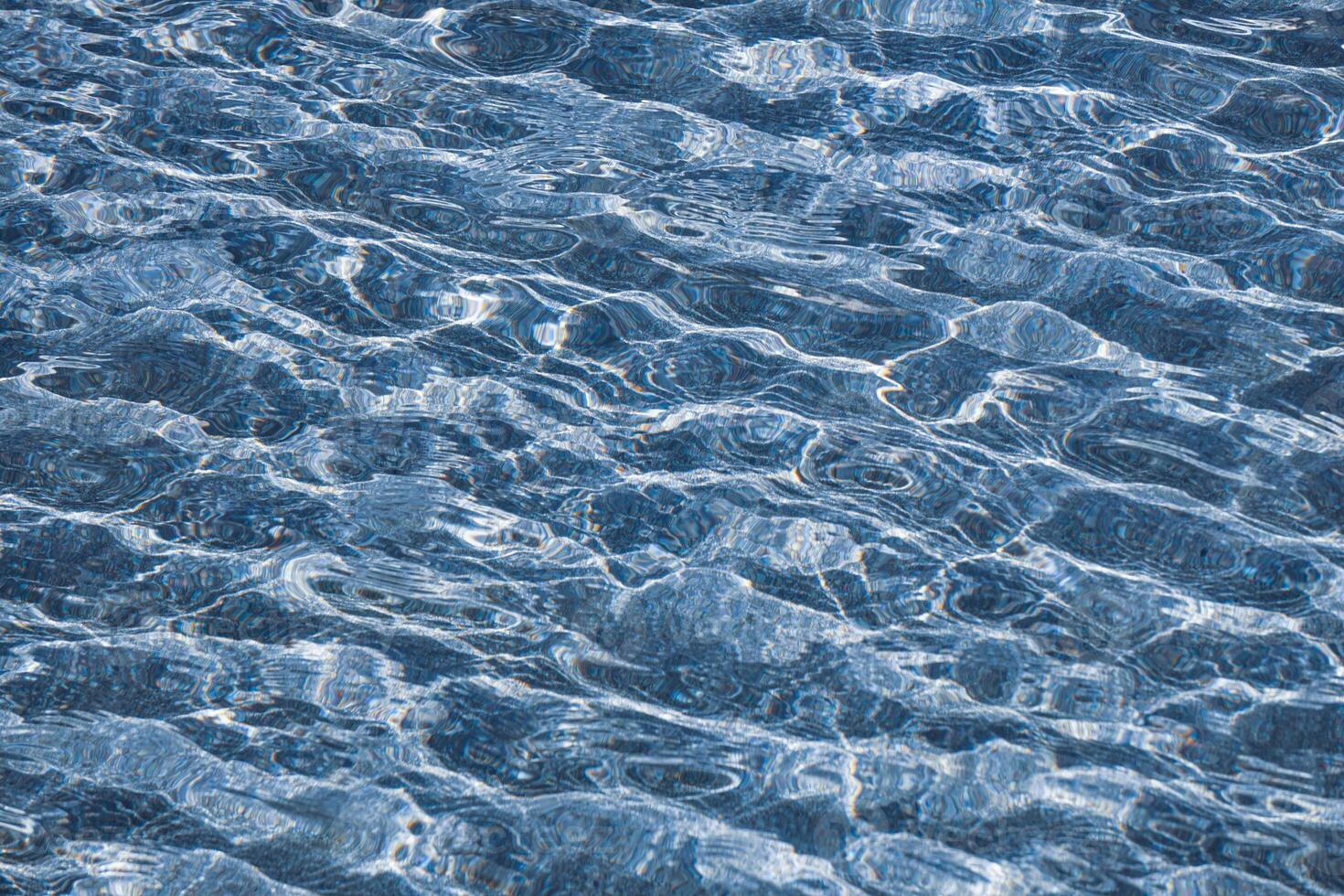 refelction an ripples on the water in the pool, color background photo