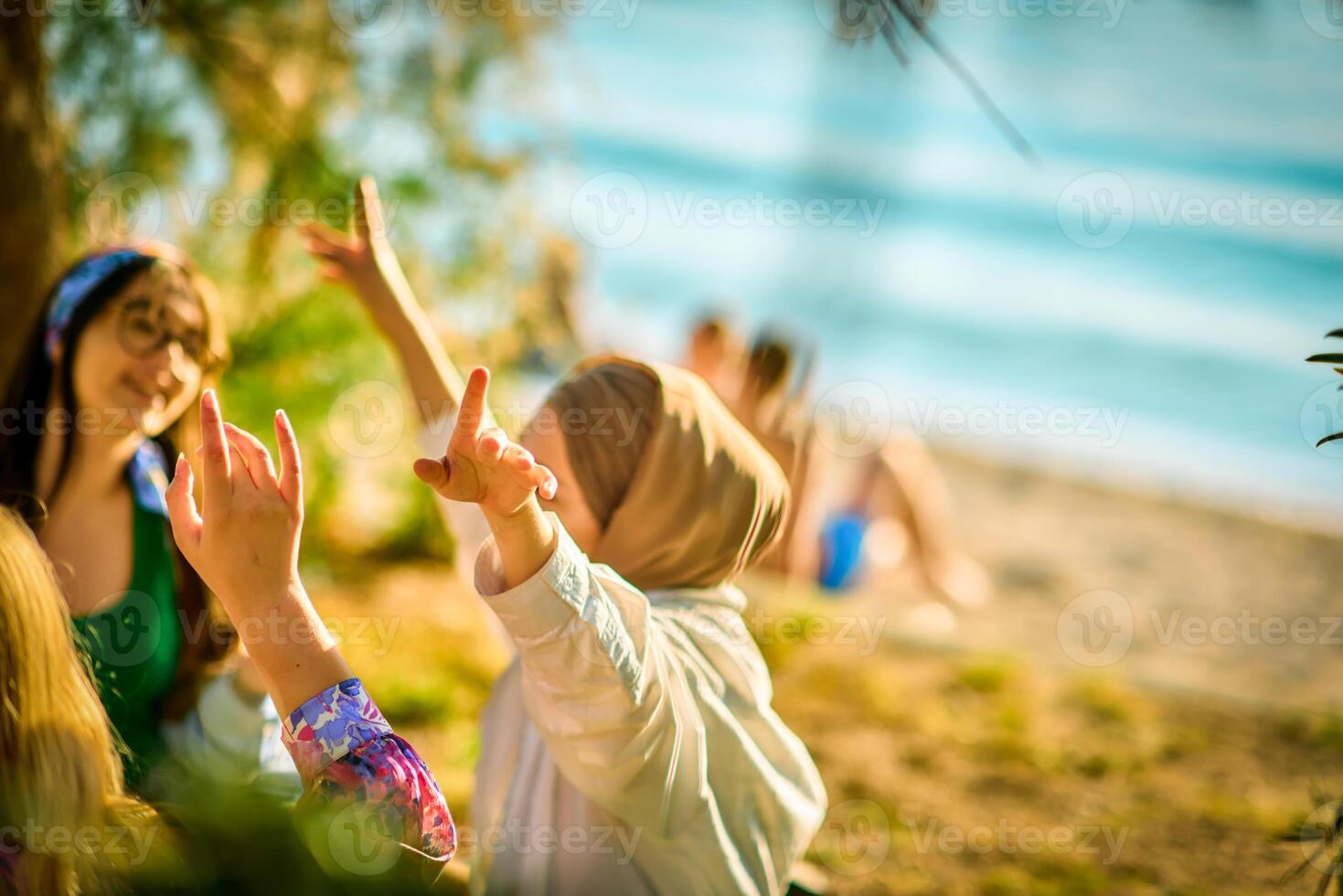Group of friends having fun on the beach photo