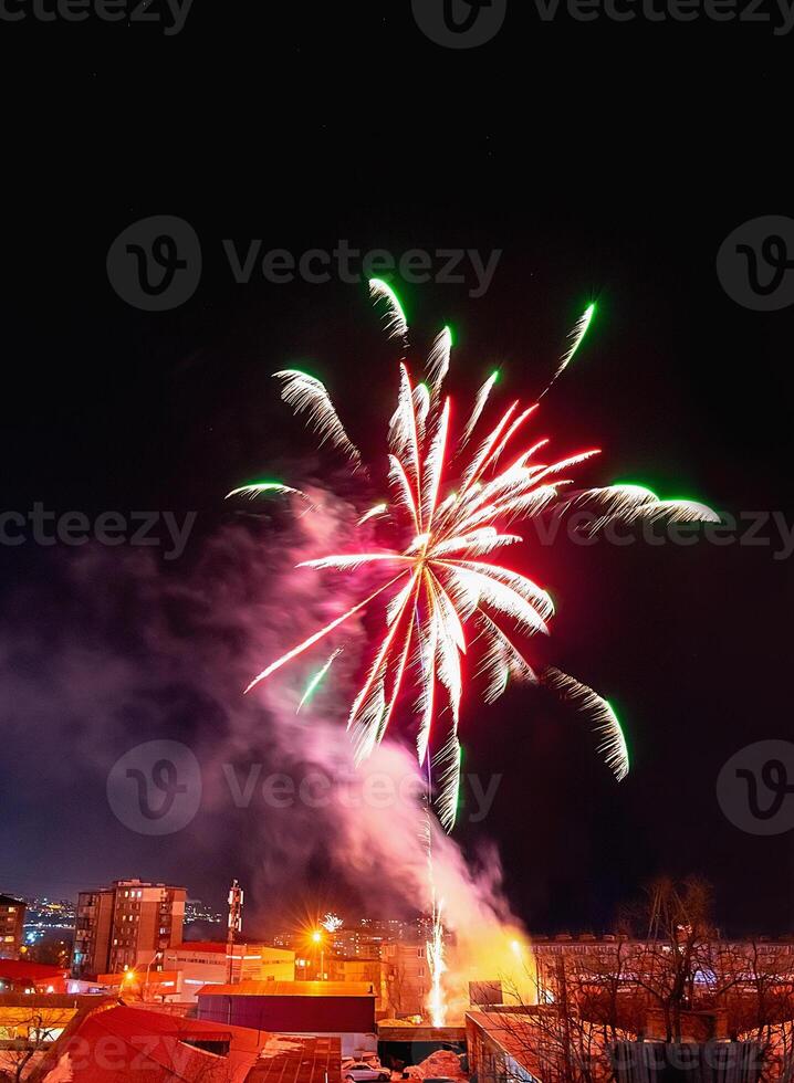 Fireworks in a residential area of Vladivostok in Russia. New Year celebrations in a poor area of a provincial town in Russia. photo
