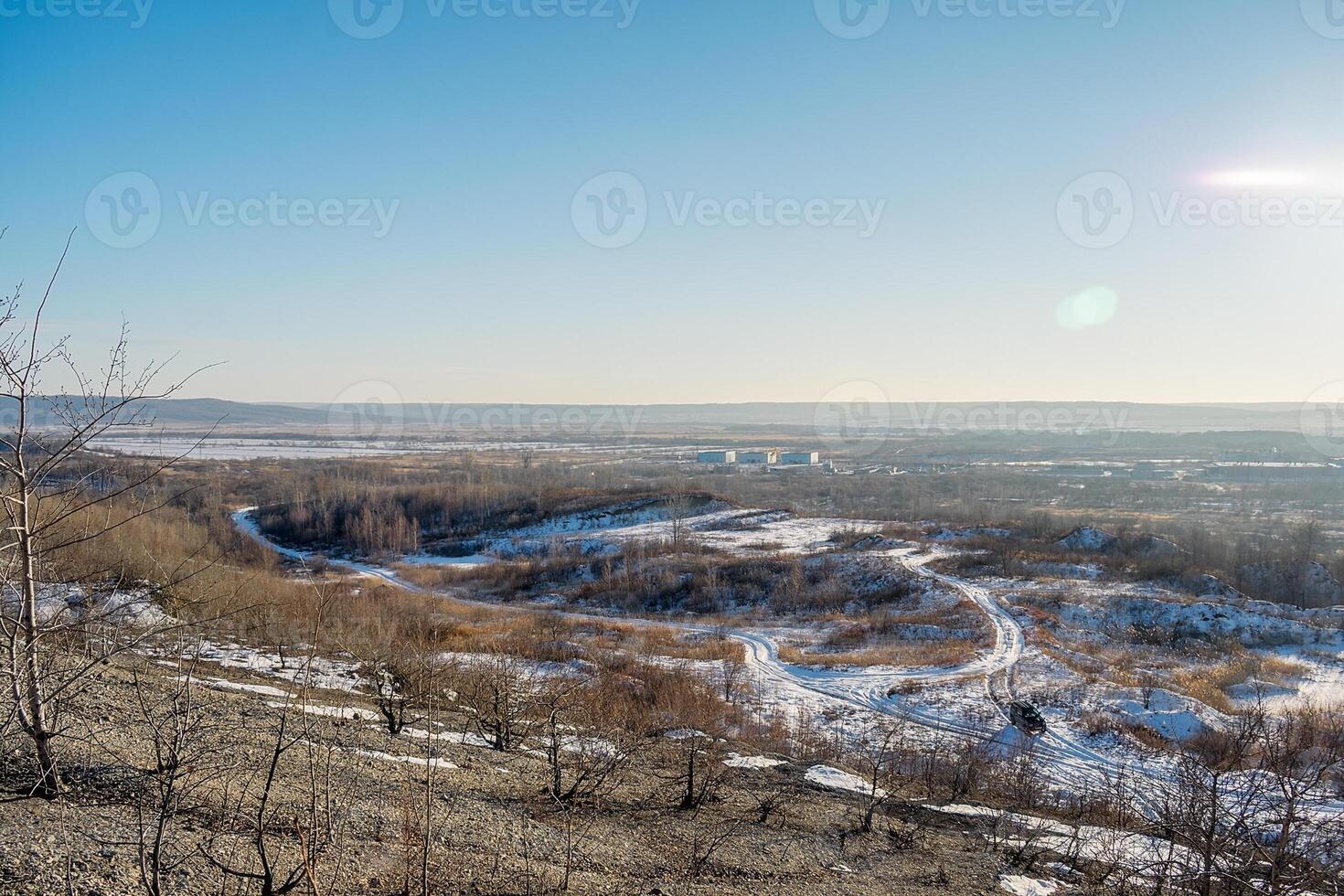 Winter landscape. View from the hill to the lowland where the small town of Ussuriysk is located in Russia. Winter day with clear sky. photo