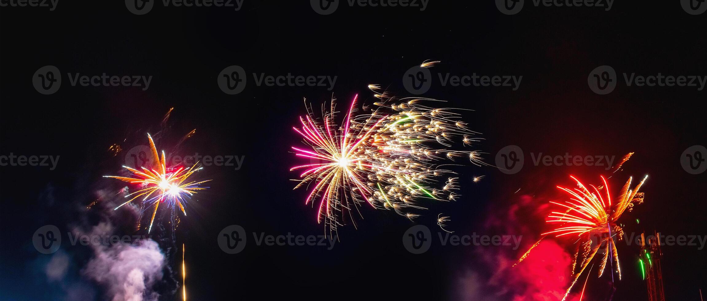 Collage of festive fireworks in the night sky. Several fireworks on a black background. photo