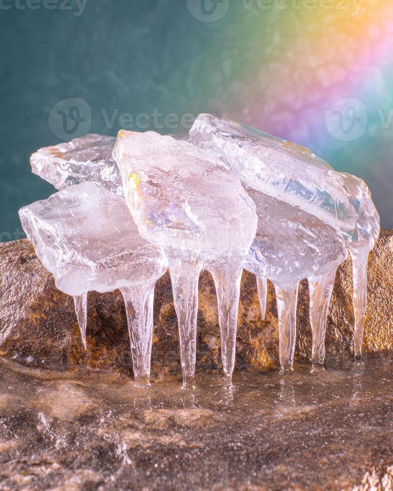 Sparkling ice crystals on a rocky surface photo