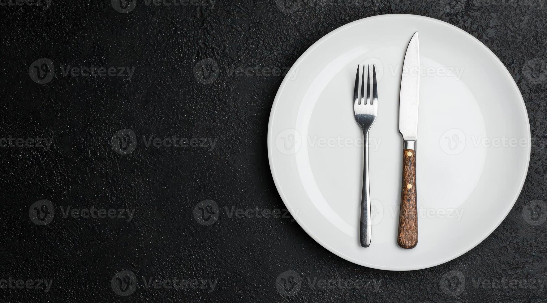 elegant table setting with fork, knife, and plate photo