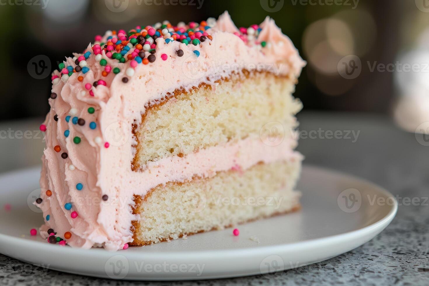 Colorful sprinkled cake slice on plate photo