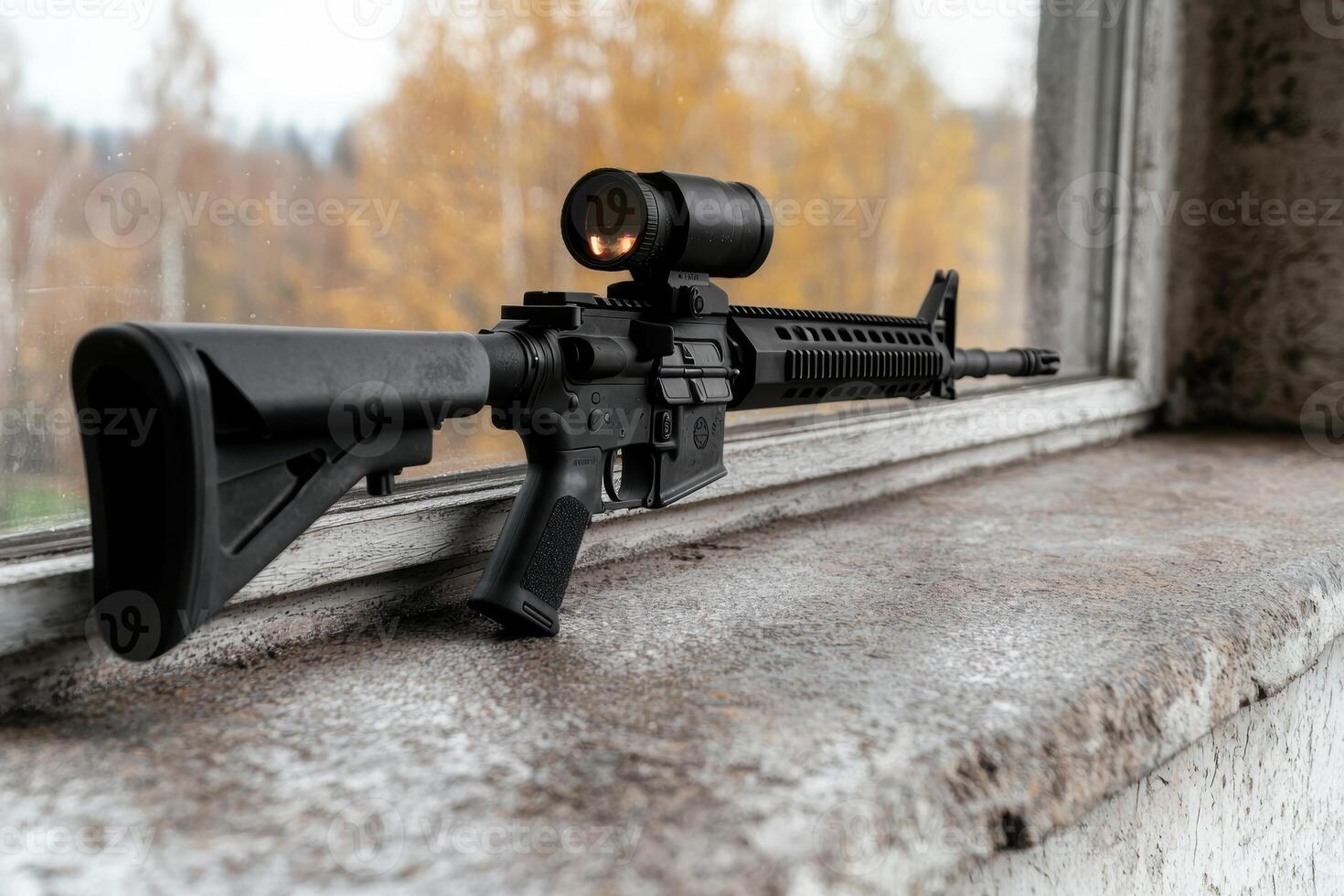 Tactical rifle with scope on wooden surface photo
