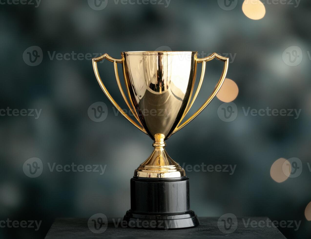 golden trophy cup on dark background photo