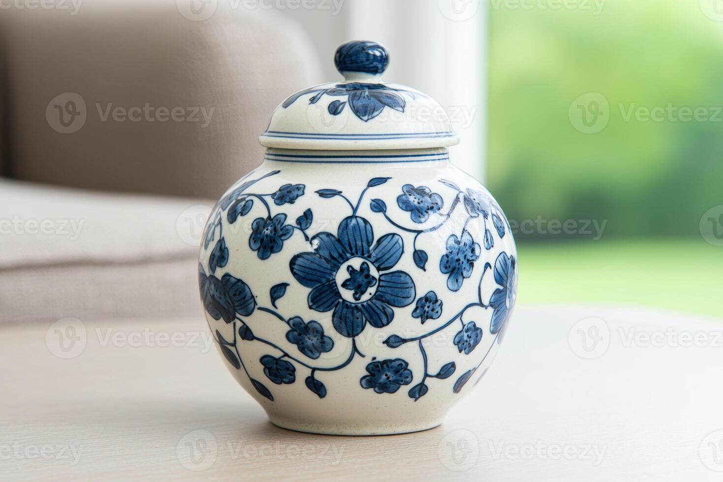 Decorative blue and white ceramic vase with floral pattern photo