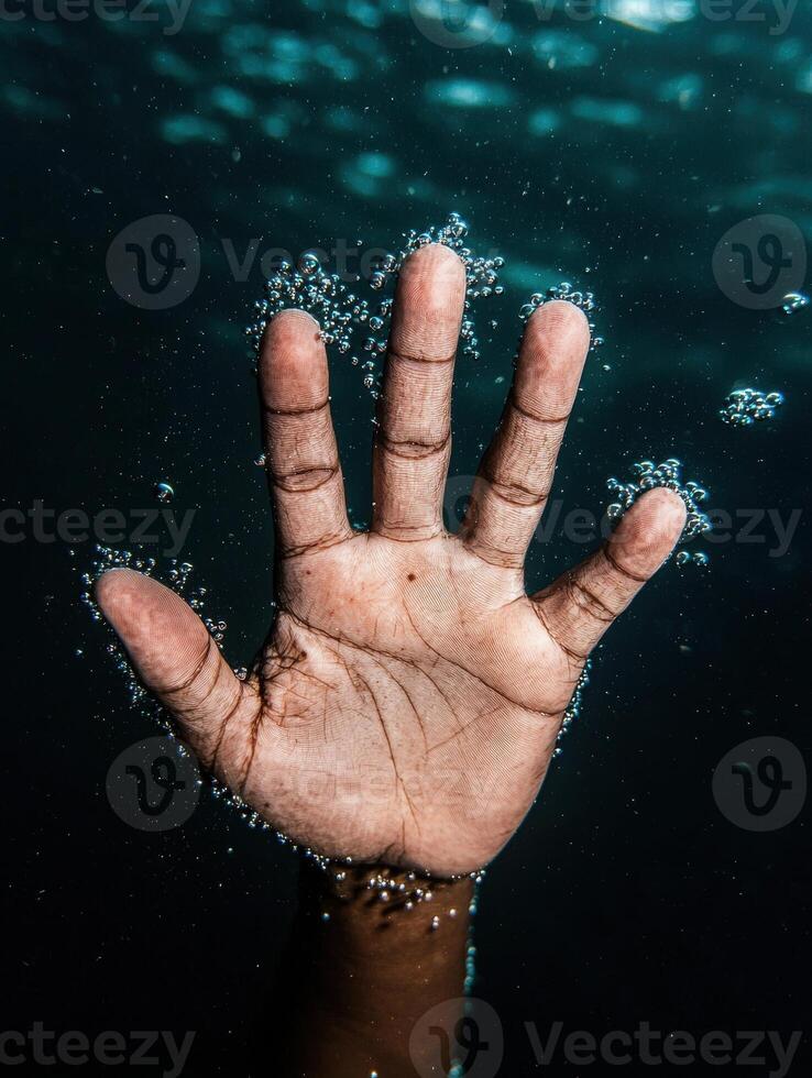 Underwater hand with bubbles photo