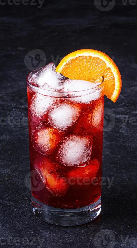 refreshing red cocktail with orange slice photo