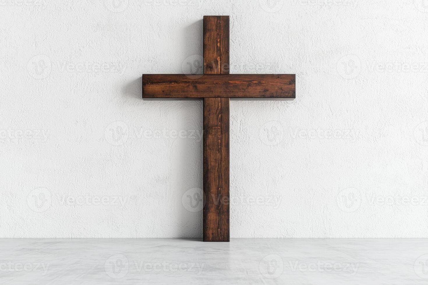 Wooden cross on a white wall photo