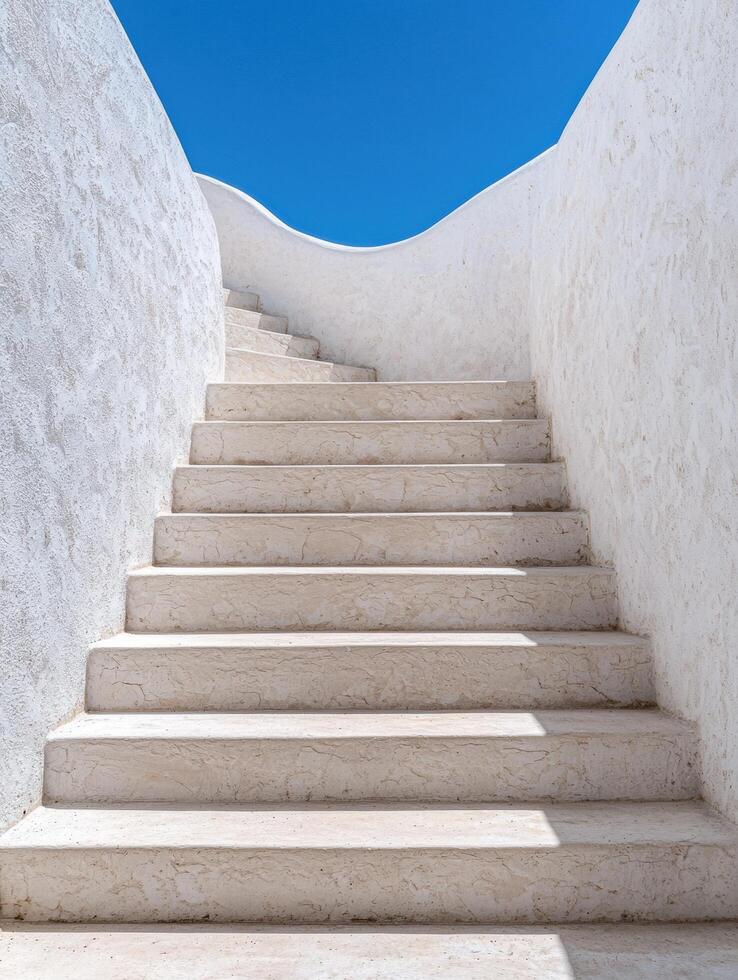 Minimalist architectural staircase leading to blue sky photo