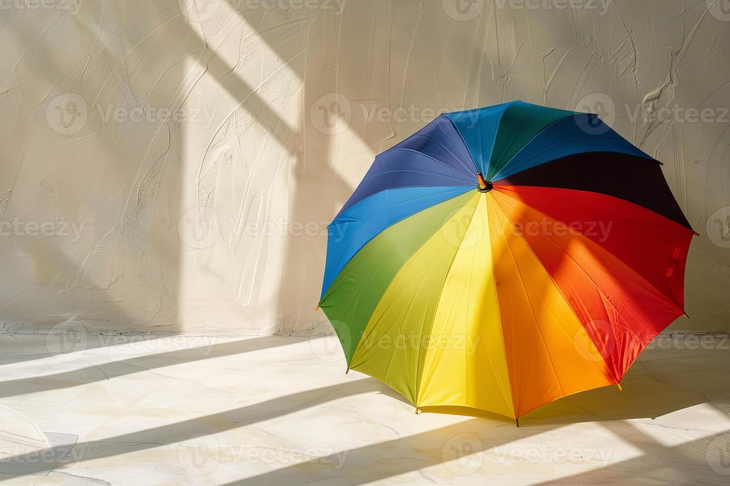 Colorful umbrella in sunlit room photo