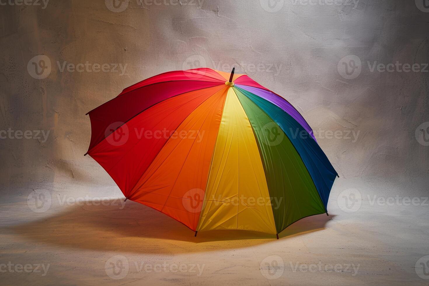 Colorful umbrella against a gray background photo