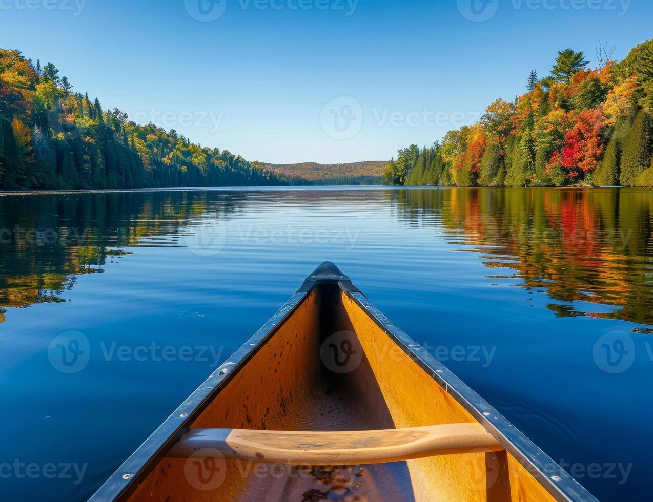 Peaceful canoe ride through autumn forest landscape photo