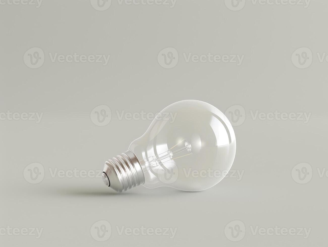 Glowing light bulb on a gray background photo