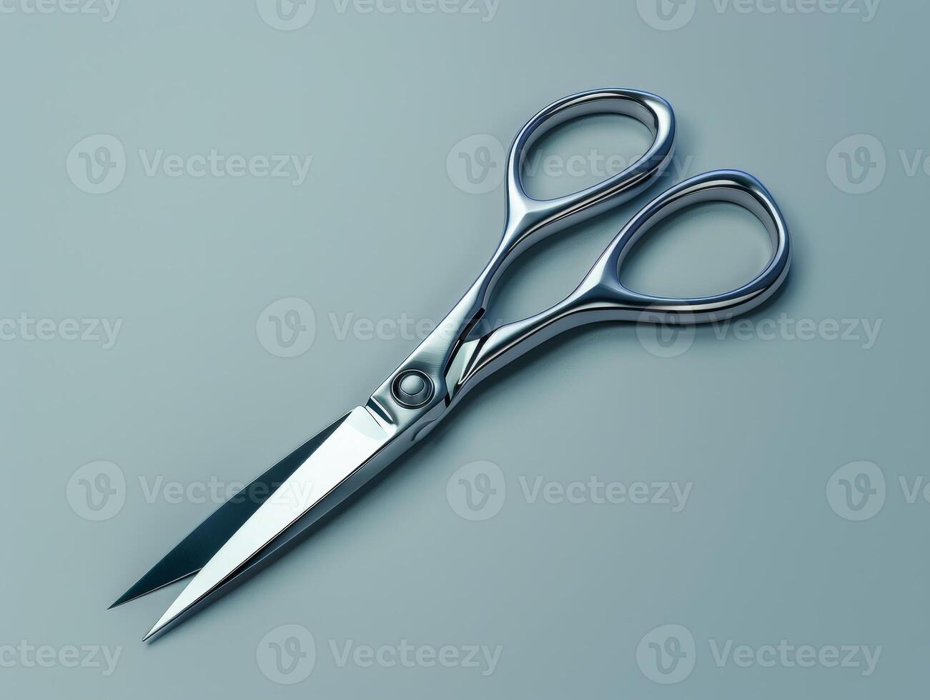 Pair of sharp metal scissors on a teal background photo