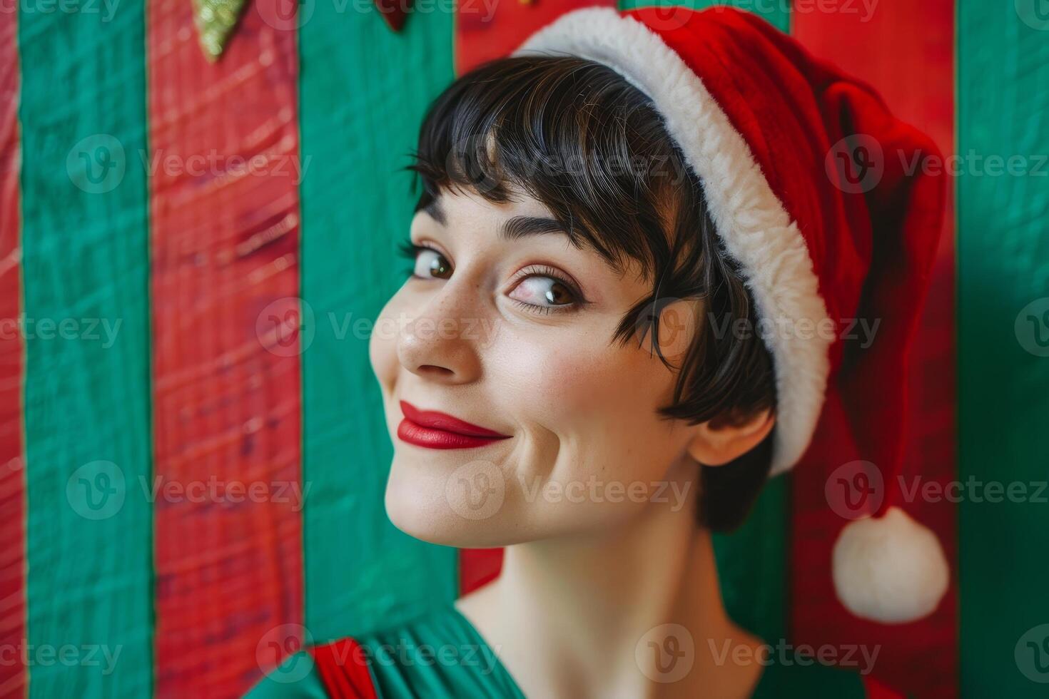 festive woman in santa hat smiling against colorful background photo
