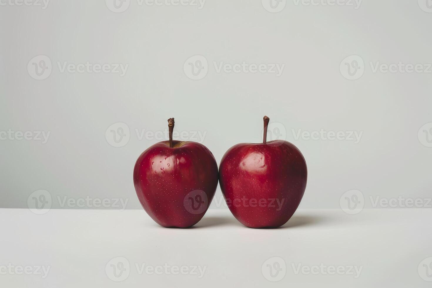 Two ripe red apples on a white background photo