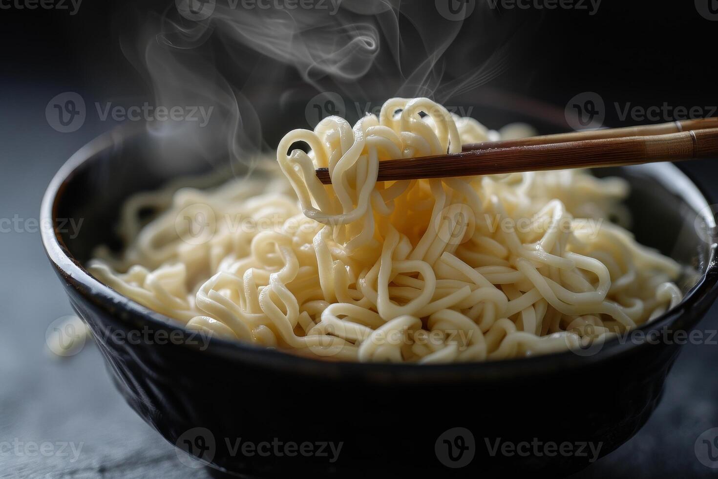 Steaming hot bowl of noodles photo