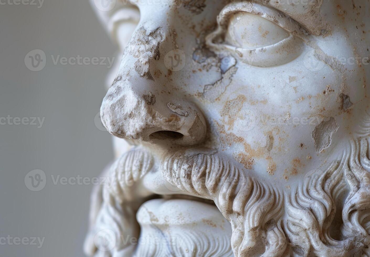 Close up of an Ancient Sculpted Face with Detailed Texture photo