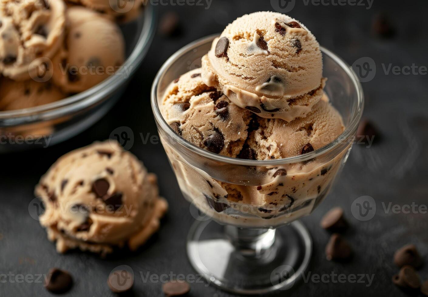 Delicious Scoops of Chocolate Chip Cookie Dough Ice Cream in Glass Bowl photo
