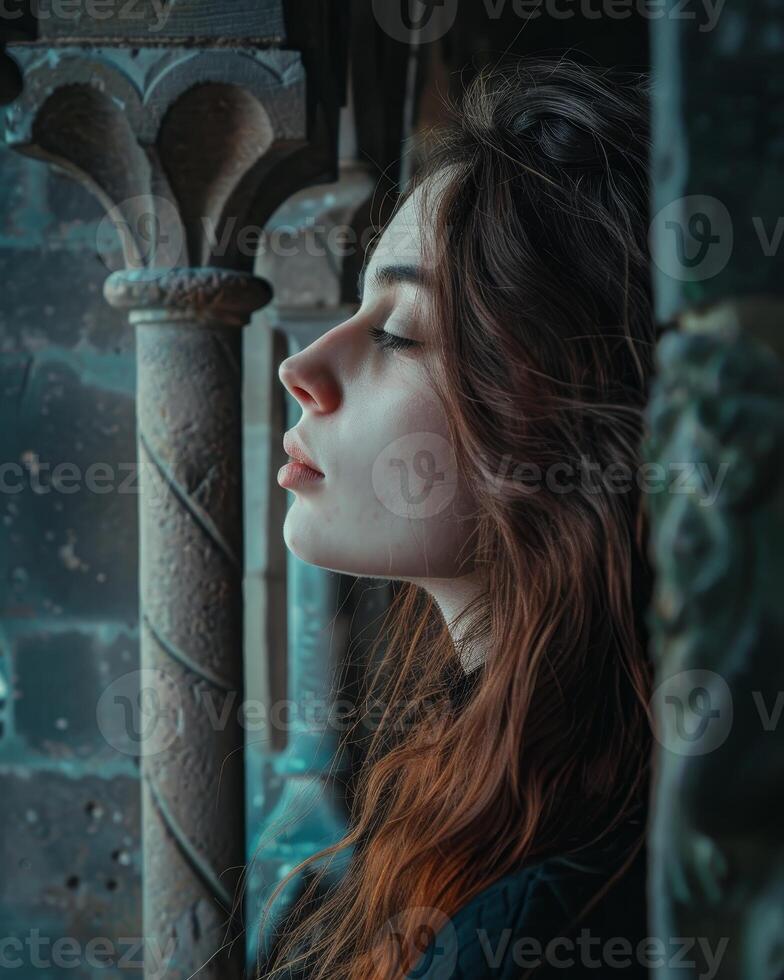 Young woman in contemplation by a vintage window photo