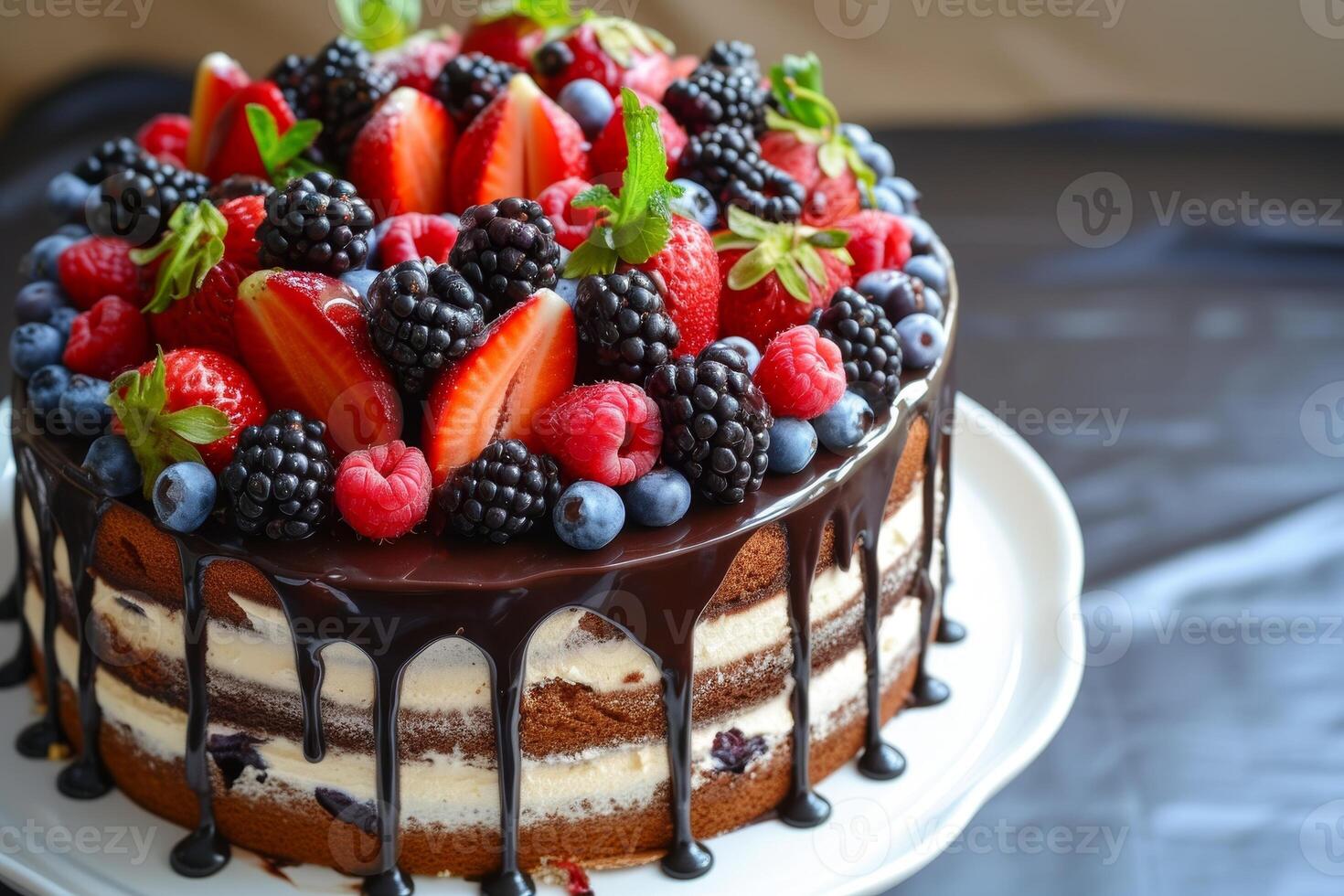 Delicious berry topped cake with chocolate drizzle photo
