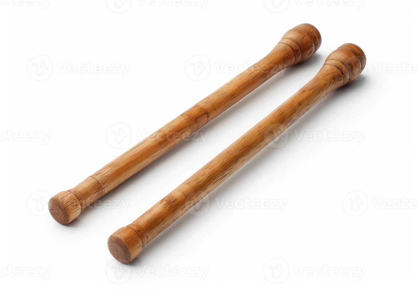 Pair of wooden drumsticks isolated on white background photo